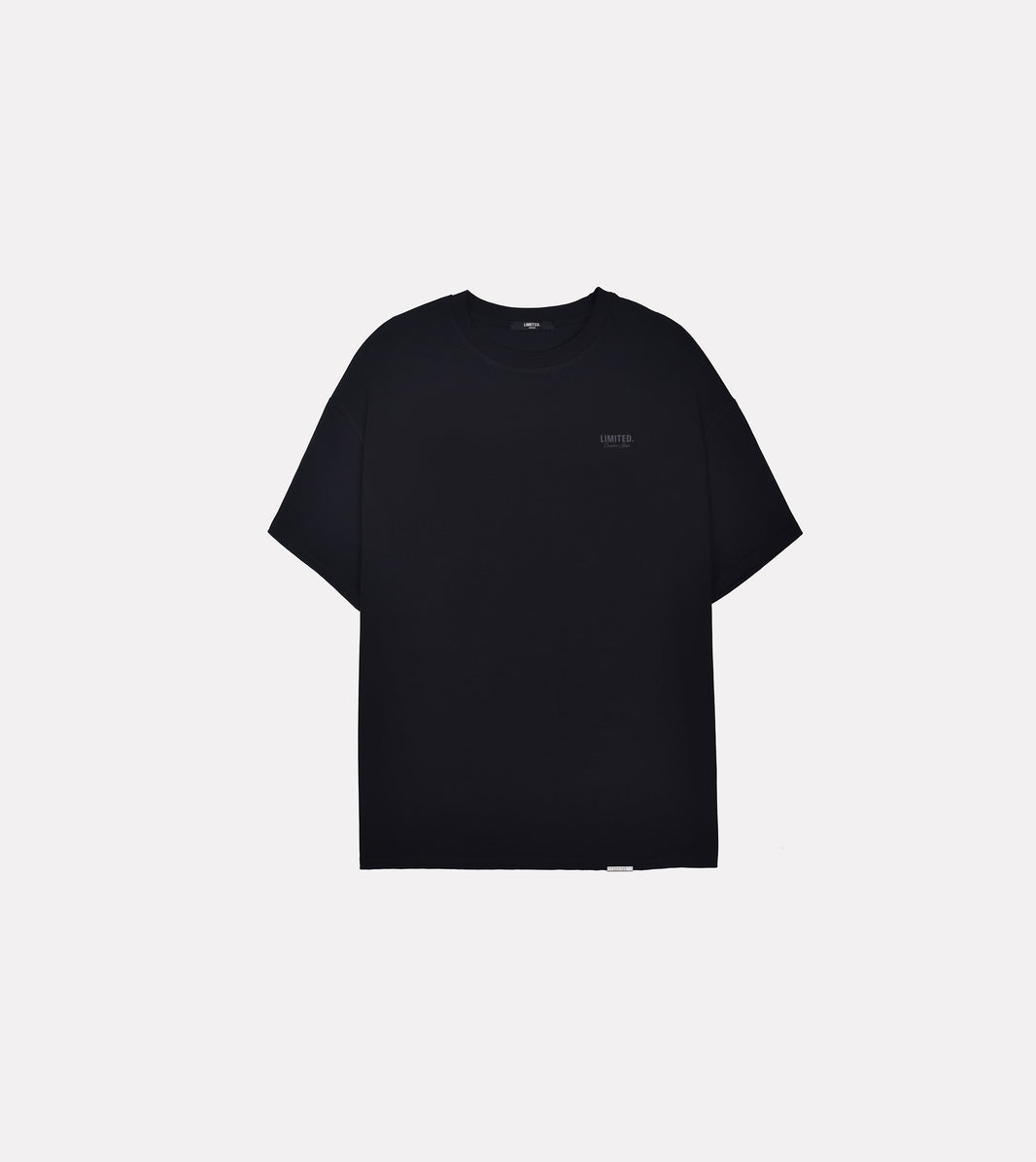 LIMITED. Oversized mens t-shirt in black with small black branding on the left chest.