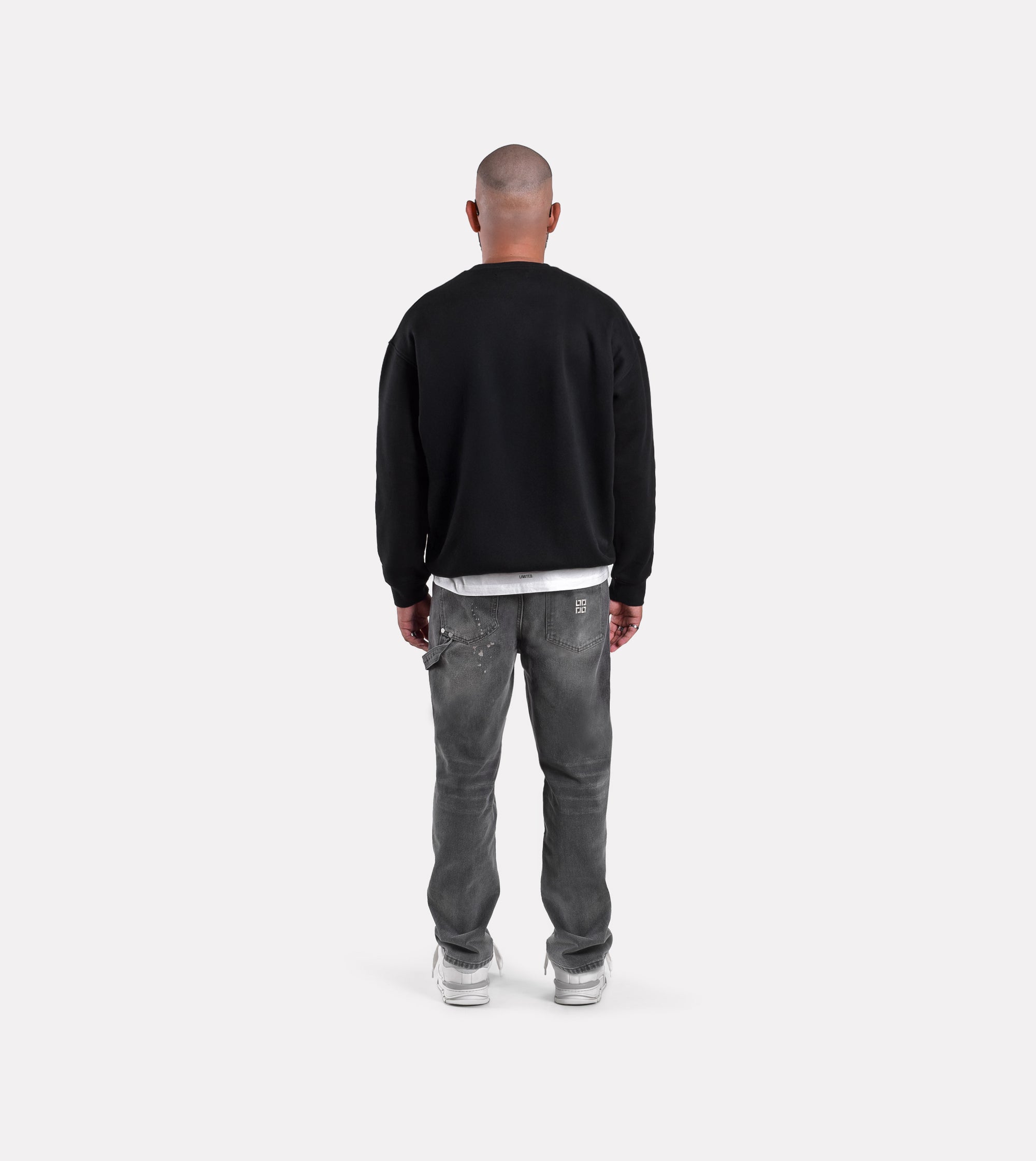 Back view of model wearing LIMITED.  mens oversized fleece sweatshirt 