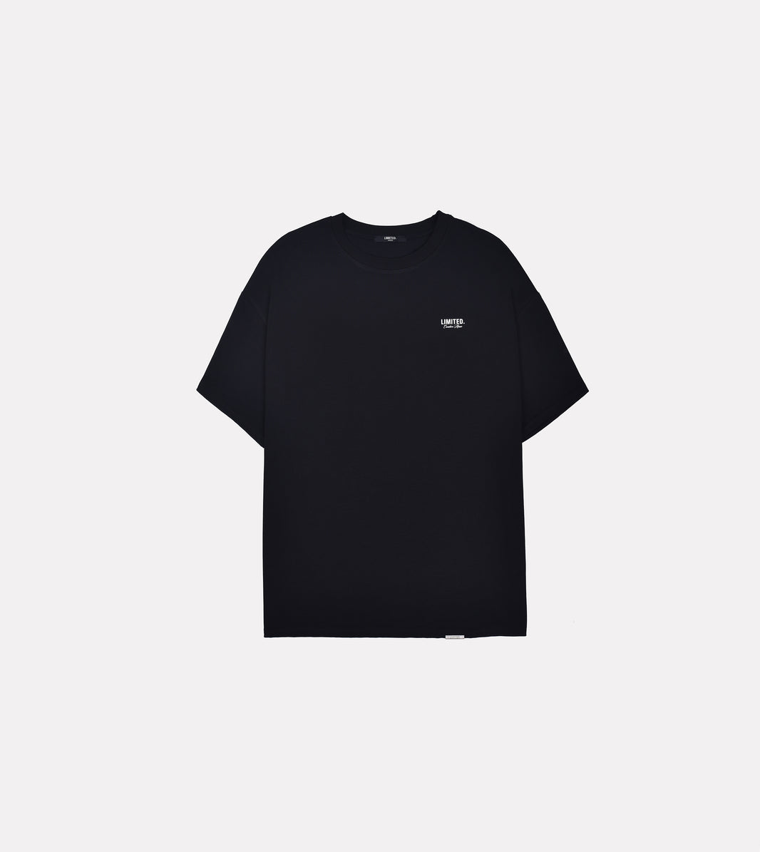 LIMITED. Oversized mens t-shirt in black with small white branding on the left chest.