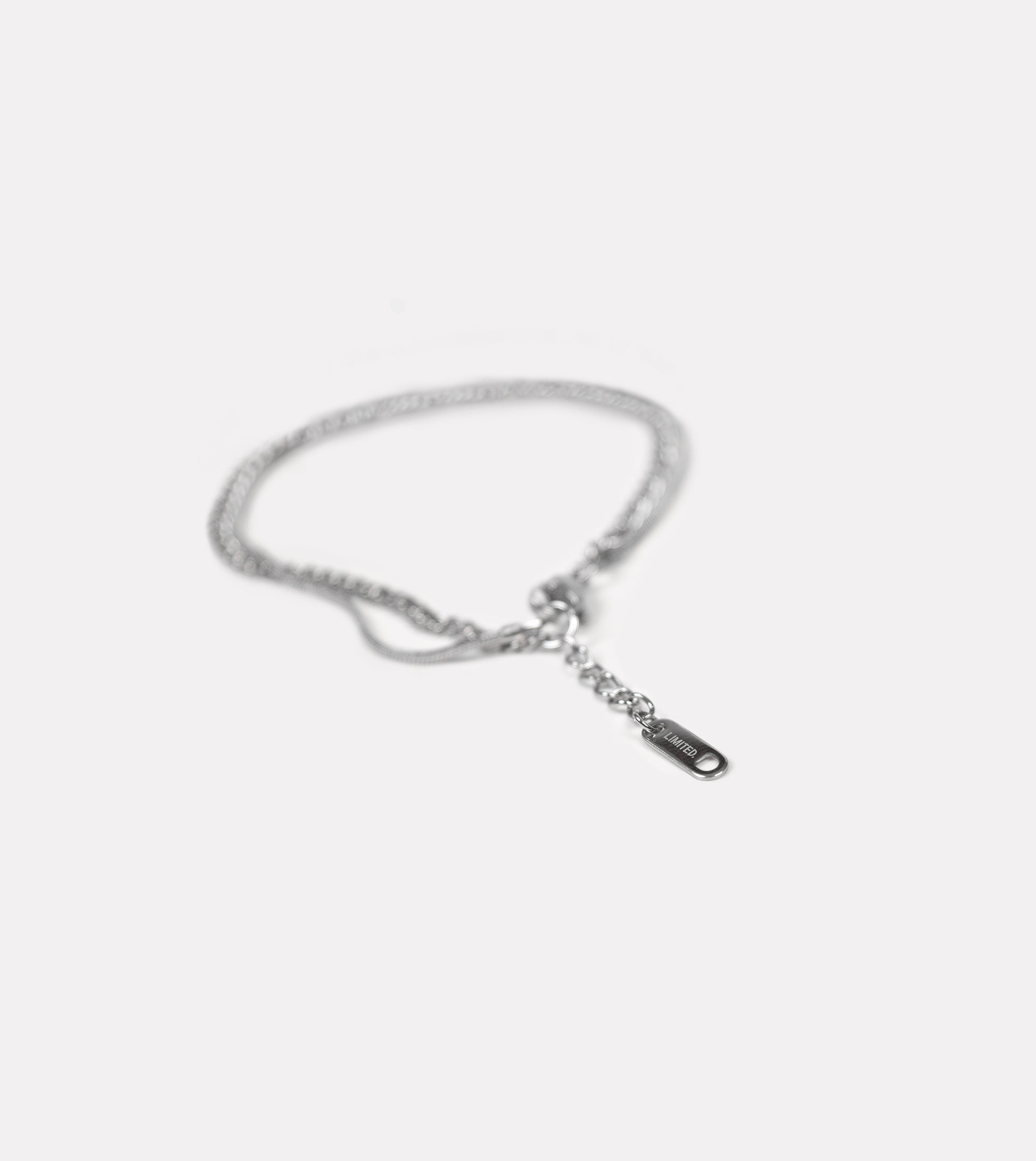 LIMITED. stainless steel double chain bracelet with engraved tag, detailed close-up